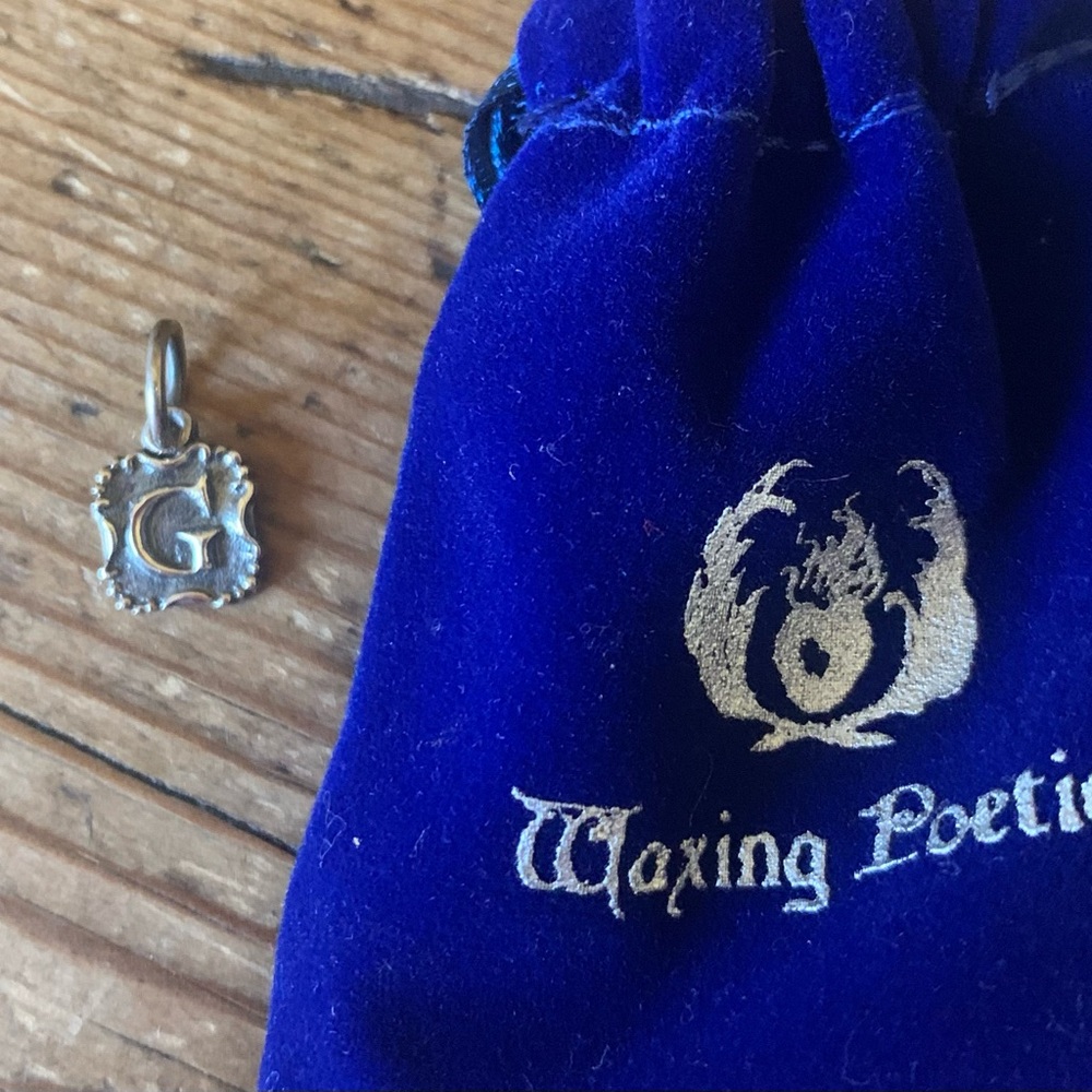 Waxing Poetic Crest Insignia “G” Charm